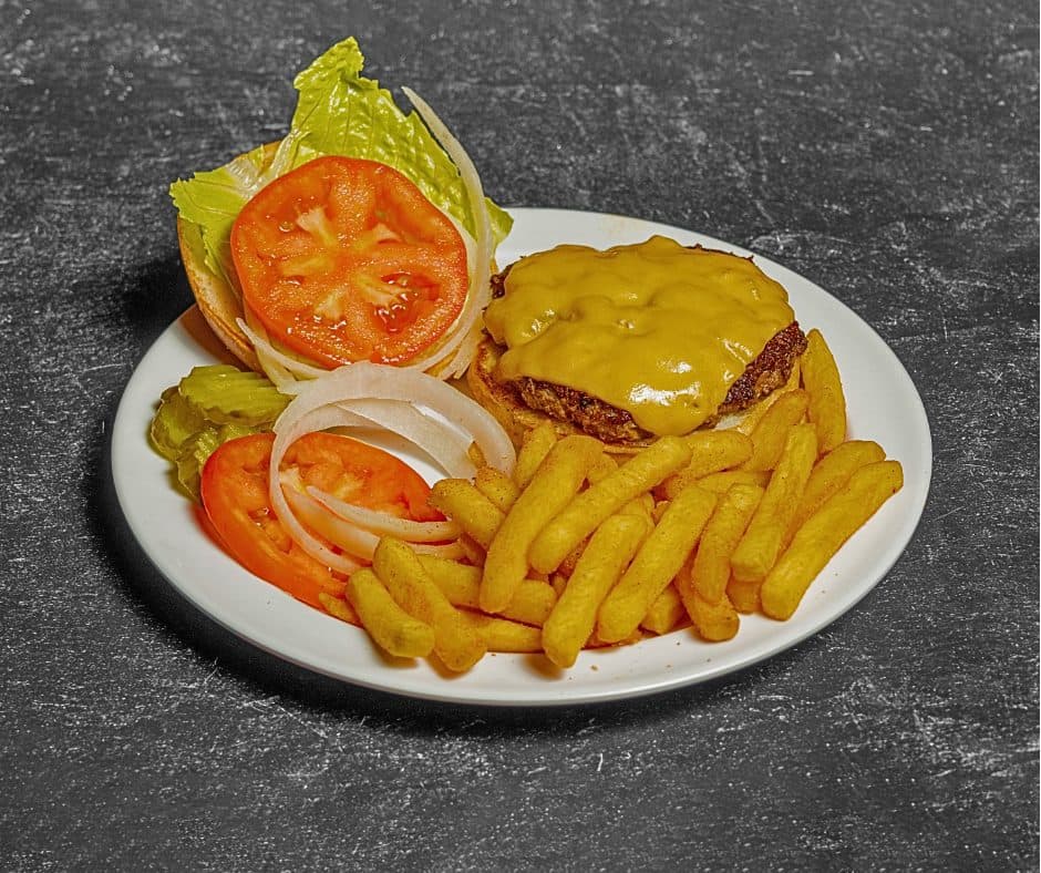 Play By Play cheeseburger with lettuce, tomato and onion, served with fries
