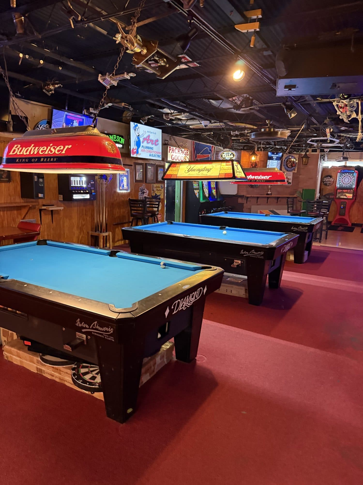 Three blue-felt Diamond pool tables inside Play By Play Sports Bar in Pompano Beach